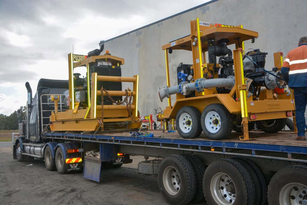 Pontoon and trailer mounted pumpsets loaded on to truck for despatch.