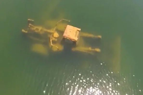 drowned heavy equipment at mine site